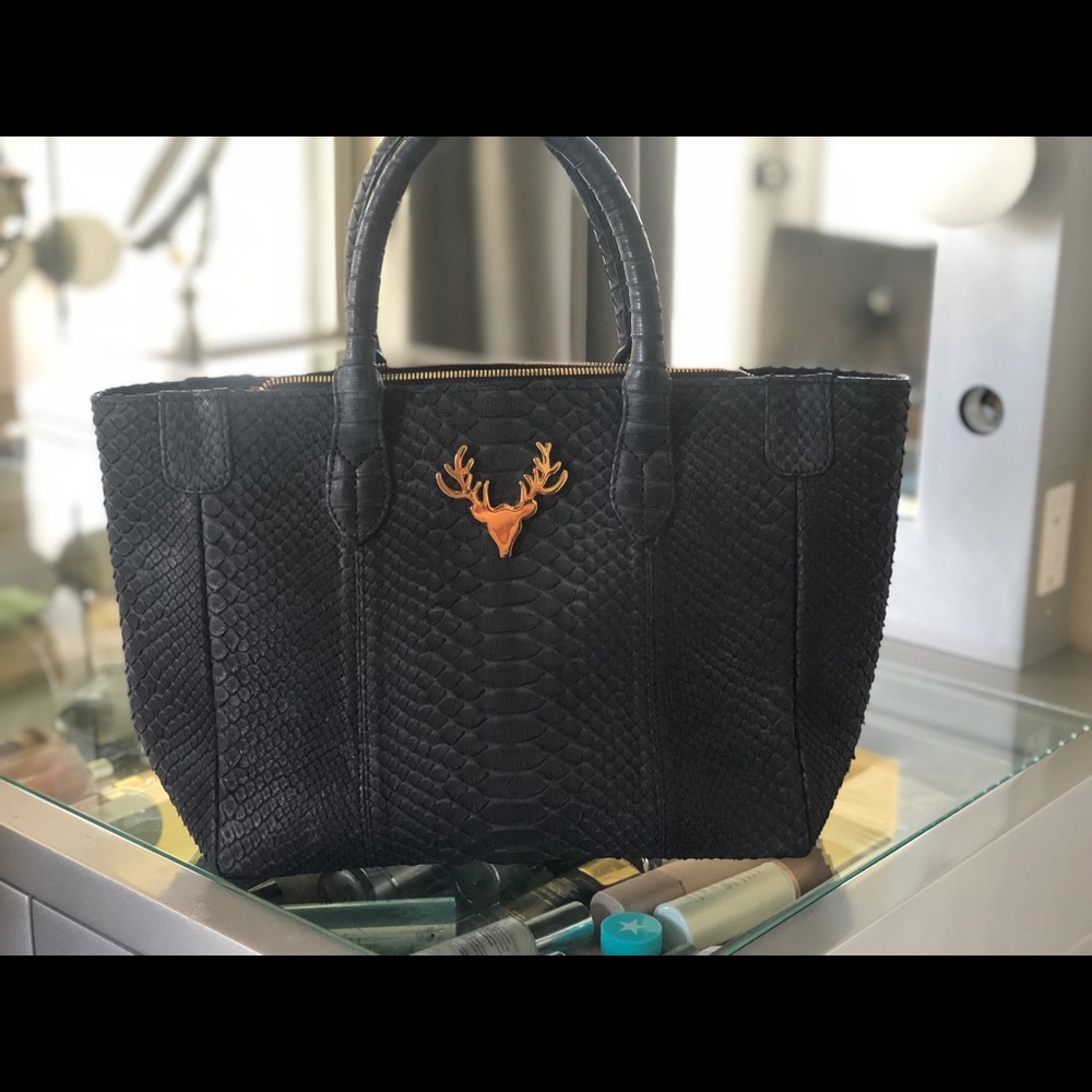 PYTHON TOTE WITH SIGNATURE ORANGE SUEDE LINING.